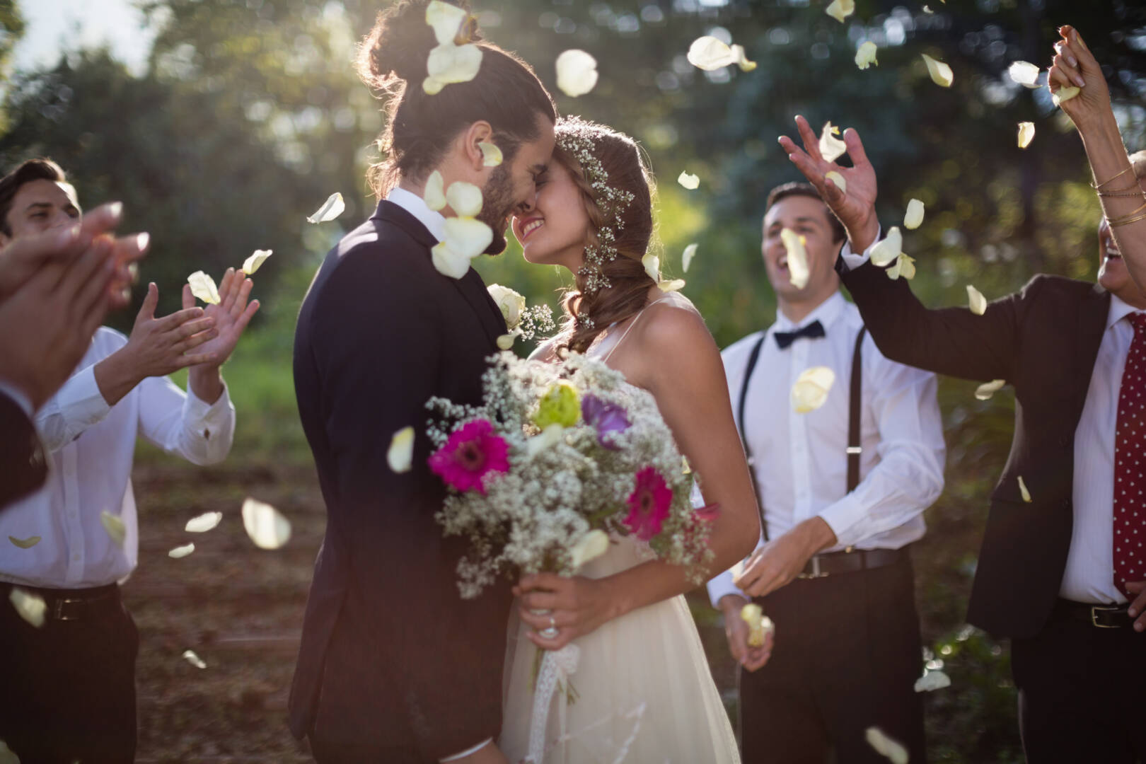 Affectionate bride and groom kissing on their wedding day